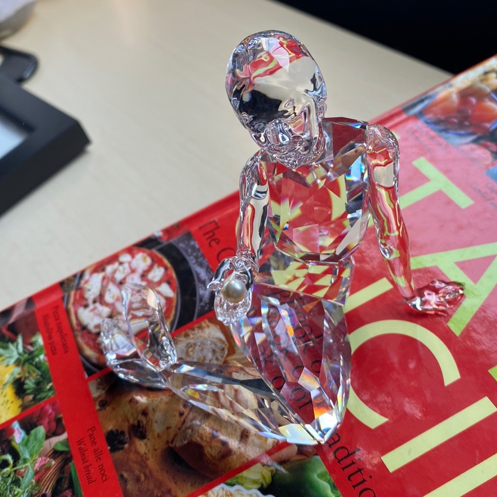 Swarovski crystal mermaid holding a pearl